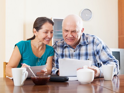 older couple looking at papers