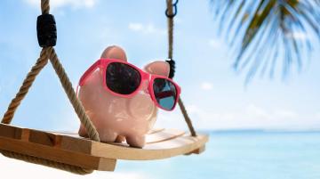 piggy bank with on the beach