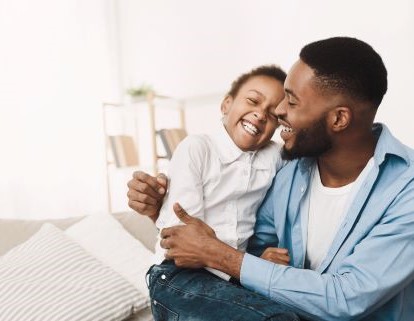 Man and child smiling