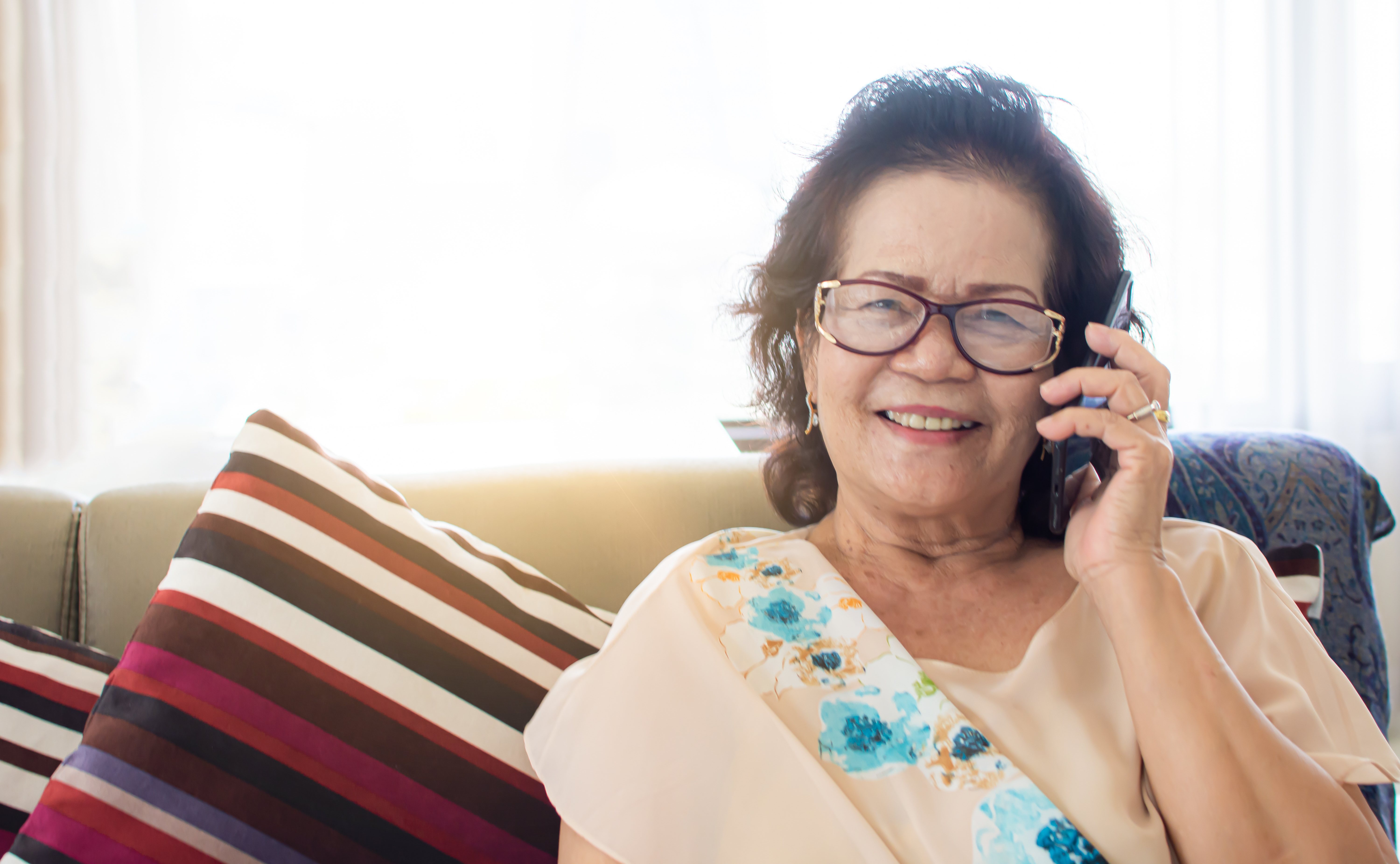 older adult woman on phone