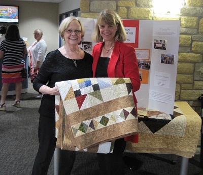 Sandy with quilt and CEO