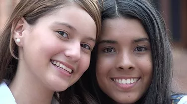 two girls smiling